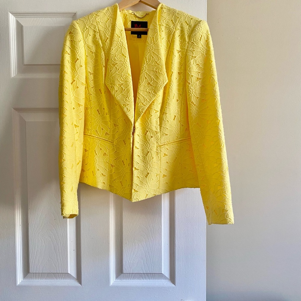 A beautiful short cut Jacket. Beautiful yellow color. Like new only worn once.